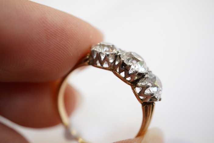 An attractive three-stone diamond ring, early 20th century